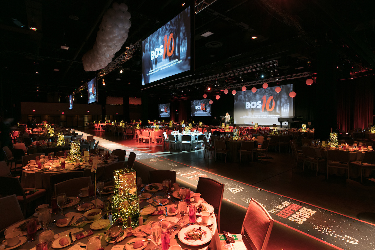 The forum ballroom with the runway crossing between dinner tables