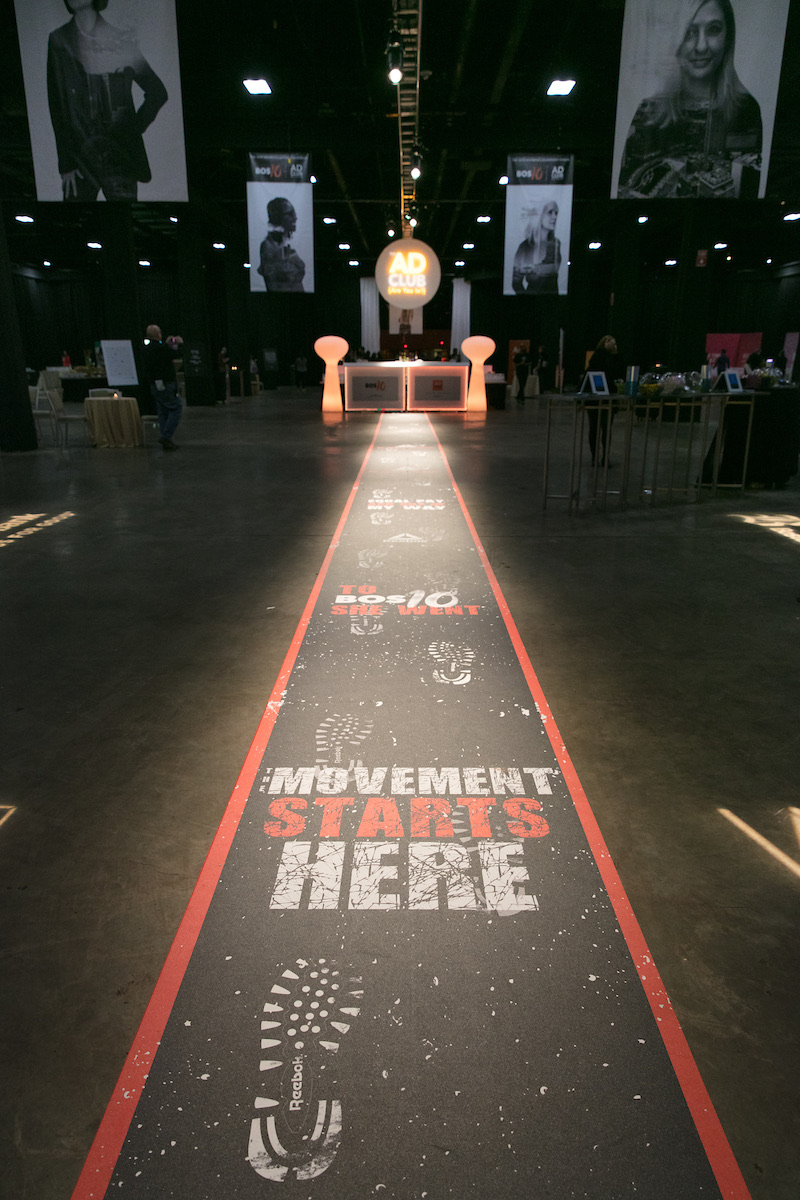 The runway leading toward the stage, reading Movement starts here