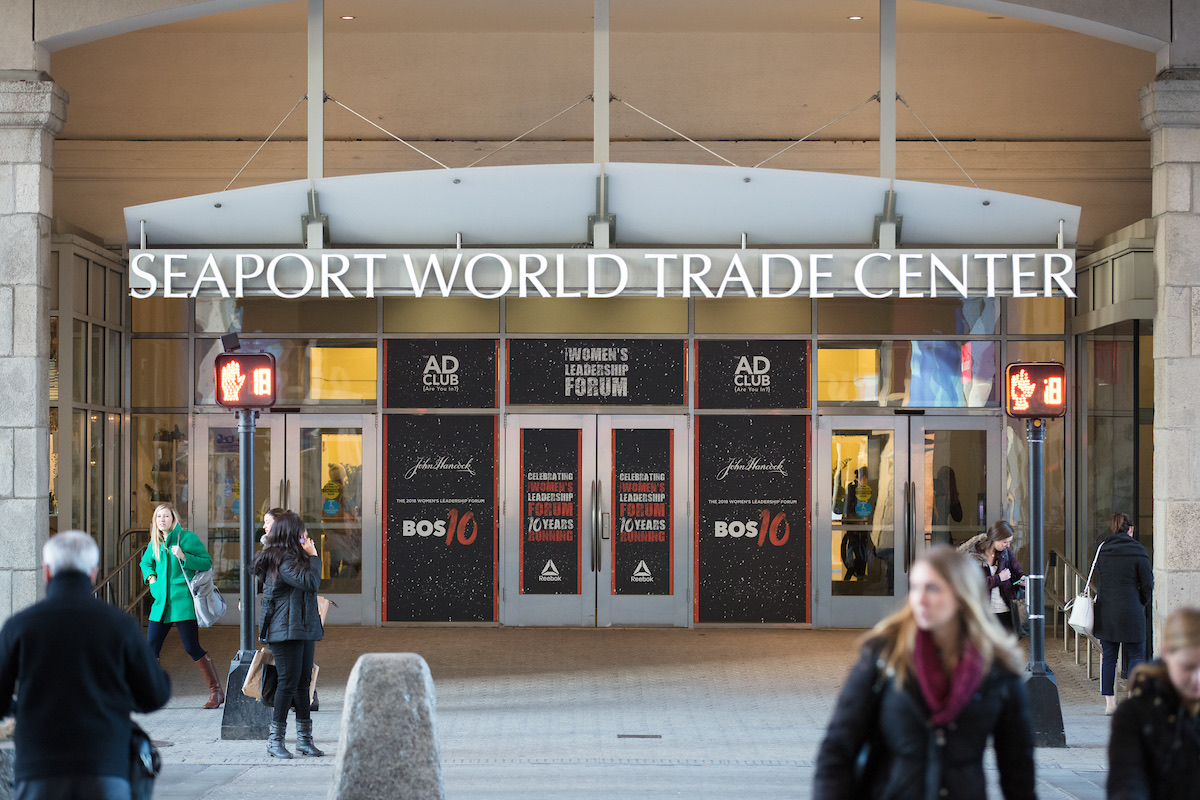 Seaport World Trade Center entrance with Women's Leadership Forum banners